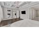 Large main bedroom offers a full-length mirror and coffered ceilings at 8121 Greys Landing Way, Raleigh, NC 27615