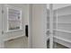 View into spacious walk-in pantry, featuring glass doors and ample shelving at 8121 Greys Landing Way, Raleigh, NC 27615