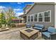 Backyard patio features a stone fire pit and comfortable seating for entertaining at 8121 Greys Landing Way, Raleigh, NC 27615