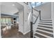 Elegant staircase leading to the upper level, with a view of the open-concept living area at 8121 Greys Landing Way, Raleigh, NC 27615