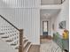 Elegant staircase with white railings and wooden steps, complemented by stylish wall paneling at 8121 Greys Landing Way, Raleigh, NC 27615