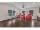Entertainment room with projector, comfortable theater chairs and hardwood flooring at 8121 Greys Landing Way, Raleigh, NC 27615