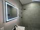 Contemporary bathroom featuring illuminated mirror, stylish vanity, and updated shower at 825 Long Ave, Rocky Mount, NC 27801
