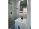 Modern bathroom vanity features a square vessel sink, backlit mirror, and tiled shower at 825 Long Ave, Rocky Mount, NC 27801
