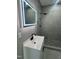 Bathroom featuring illuminated mirror, stylish vanity, and updated shower with dark fixtures at 825 Long Ave, Rocky Mount, NC 27801