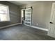 Bedroom showcasing a modern sliding door leading to the bathroom, complemented by neutral walls and flooring at 825 Long Ave, Rocky Mount, NC 27801