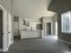 Open concept living space showcasing kitchen with modern white cabinets, stainless steel appliances, and a center island at 825 Long Ave, Rocky Mount, NC 27801