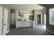 Open concept living space showcasing kitchen with modern white cabinets and stainless steel appliances and center island at 825 Long Ave, Rocky Mount, NC 27801
