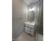 Bathroom featuring modern lighting, a new vanity, and a tiled stand-up shower at 905 Ardmore Dr, Durham, NC 27713