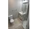 Modern bathroom featuring a glass shower, sleek vanity, toilet, and light gray walls at 905 Ardmore Dr, Durham, NC 27713