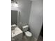 Neutral bathroom design includes a toilet, vanity with sink, and a well-lit mirror at 905 Ardmore Dr, Durham, NC 27713