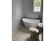 Relaxing bathroom with a freestanding tub, stylish faucet, and tiled floor, ready for spa days at 905 Ardmore Dr, Durham, NC 27713