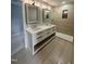 Bathroom boasts double sinks, framed mirrors, and a stand-up shower with tiled walls at 905 Ardmore Dr, Durham, NC 27713