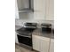 Modern kitchen appliances with stainless steel finishings and white subway tile back-splash, creating a sleek design at 905 Ardmore Dr, Durham, NC 27713