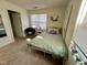 Bright bedroom featuring a full-sized bed, ample natural light, and a view of the closet and mirror at 1140 Carlton Ave # 201, Raleigh, NC 27606