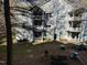 Exterior angle view of a residential building with balconies and well-maintained landscaping at 1140 Carlton Ave # 201, Raleigh, NC 27606