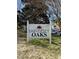 University Oaks community sign with mature trees at 1140 Carlton Ave # 201, Raleigh, NC 27606