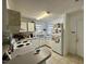 Bright kitchen with ample cabinet space, white appliances, and a functional layout for easy meal preparation at 1140 Carlton Ave # 201, Raleigh, NC 27606