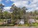 Aerial view of the house, trees, and a yard at 1203 Brookside Dr, Raleigh, NC 27604