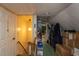 Image displays the attic with carpeted floors, storage boxes and clothing racks at 1203 Brookside Dr, Raleigh, NC 27604