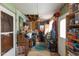 Cluttered storage space with an open ceiling, filled with boxes, furniture, and household items at 1203 Brookside Dr, Raleigh, NC 27604