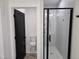 Modern bathroom featuring glass shower and separated toilet at 124 Horseman Dr, Louisburg, NC 27549