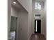 Bright entryway with wood floors, white walls, and a dark front door with two windows at 124 Horseman Dr, Louisburg, NC 27549