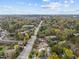 Expansive aerial view capturing the community with lush greenery and distant cityscape at 130 E Longview St # Apt K, Chapel Hill, NC 27516