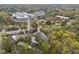 Aerial view showcasing residential complex nestled in lush greenery with city skyline visible at 130 E Longview St # Apt K, Chapel Hill, NC 27516