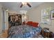 Comfortable bedroom with a large bed, ceiling fan, window with blinds and a closet, exudes relaxation at 130 E Longview St # Apt K, Chapel Hill, NC 27516