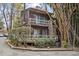 Unique property featuring a deck, a chimney, and verdant landscaping at 130 E Longview St # Apt K, Chapel Hill, NC 27516