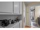 Bright hallway features built-in cabinets and a view into the adjacent bathroom, with neutral color scheme at 130 E Longview St # Apt K, Chapel Hill, NC 27516