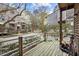 View of the patio overlooking the parking area and the charming surroundings of a building in the background at 130 E Longview St # Apt K, Chapel Hill, NC 27516