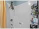 Bathroom shower with a white interior, complete with a showerhead, shower rack, and curtain at 130 E Longview St # Apt K, Chapel Hill, NC 27516