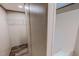 Bright bathroom featuring a shower-tub combo with sleek fixtures, and a closet with white wire shelving at 1326 Stephens Dr, Roxboro, NC 27573