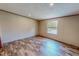 Bedroom with natural light, neutral walls, and wood-look flooring at 1326 Stephens Dr, Roxboro, NC 27573