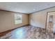Bright bedroom offering natural light and wood-look flooring for a clean finish at 1326 Stephens Dr, Roxboro, NC 27573