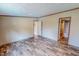 Bedroom with an attached bathroom showcasing modern interior design and flooring at 1326 Stephens Dr, Roxboro, NC 27573