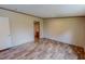 Bedroom with wood-look flooring and a doorway to another room at 1326 Stephens Dr, Roxboro, NC 27573