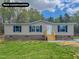 Charming one-story home with new construction and well-manicured lawn and navy-blue shutters at 1326 Stephens Dr, Roxboro, NC 27573