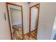 A hallway between two rooms, with a white door leading to the next room at 1326 Stephens Dr, Roxboro, NC 27573