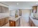Bright kitchen with an island, modern cabinetry, and views into the living area at 1326 Stephens Dr, Roxboro, NC 27573