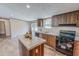 Inviting kitchen showcasing island, wood cabinets, countertops, and modern stainless steel appliances at 1326 Stephens Dr, Roxboro, NC 27573