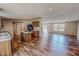 Inviting kitchen with wood cabinets, island, and open layout connecting to the living room at 1326 Stephens Dr, Roxboro, NC 27573
