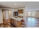Functional kitchen featuring an island, wood cabinets, appliances, and an open layout at 1326 Stephens Dr, Roxboro, NC 27573