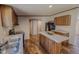 Well-equipped kitchen with a functional island, stainless steel sink, and modern finishes at 1326 Stephens Dr, Roxboro, NC 27573