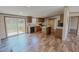 Bright kitchen with stainless steel appliances, wood cabinets and an island, and a sliding glass door at 1326 Stephens Dr, Roxboro, NC 27573