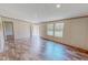 A spacious living room with a view from the windows and recessed ceiling lights at 1326 Stephens Dr, Roxboro, NC 27573