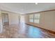 Spacious living room with natural light, beautiful flooring, and an open entryway at 1326 Stephens Dr, Roxboro, NC 27573