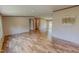 Spacious living room features wood-look floors and neutral walls, creating a warm and inviting space at 1326 Stephens Dr, Roxboro, NC 27573
